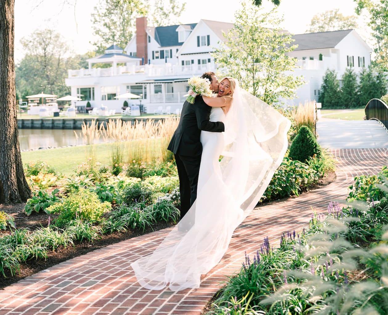 Couple embracing on a garden path