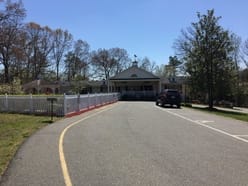 Marian Manor of Stafford, assisted living in Stafford, VA — Entrance of a senior living facility surrounded by trees