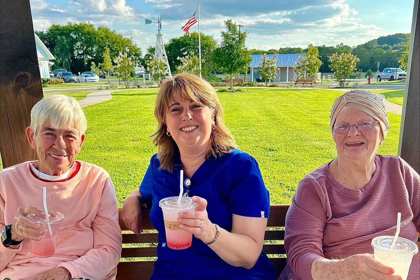Residents enjoying drinks outdoors in a sunny setting
