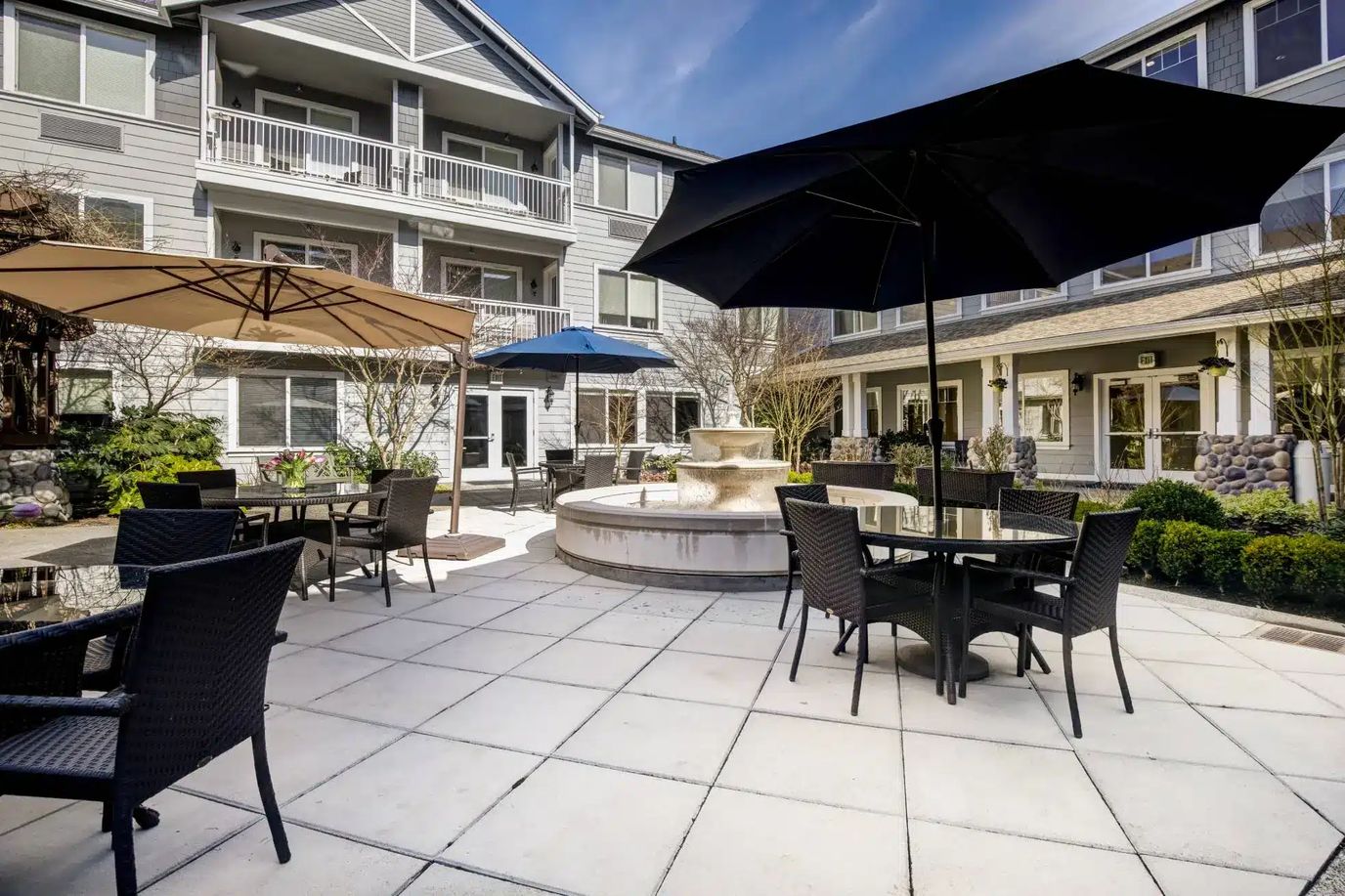 Outdoor patio area with seating and umbrellas