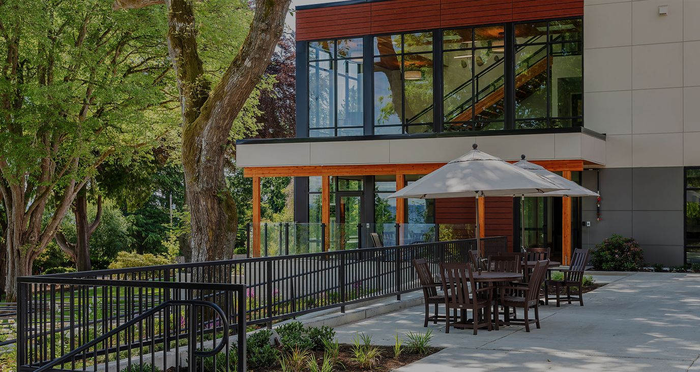 Outdoor seating area next to the facility building
