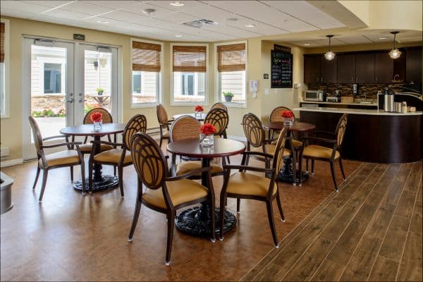 Bright dining room with round tables and chairs