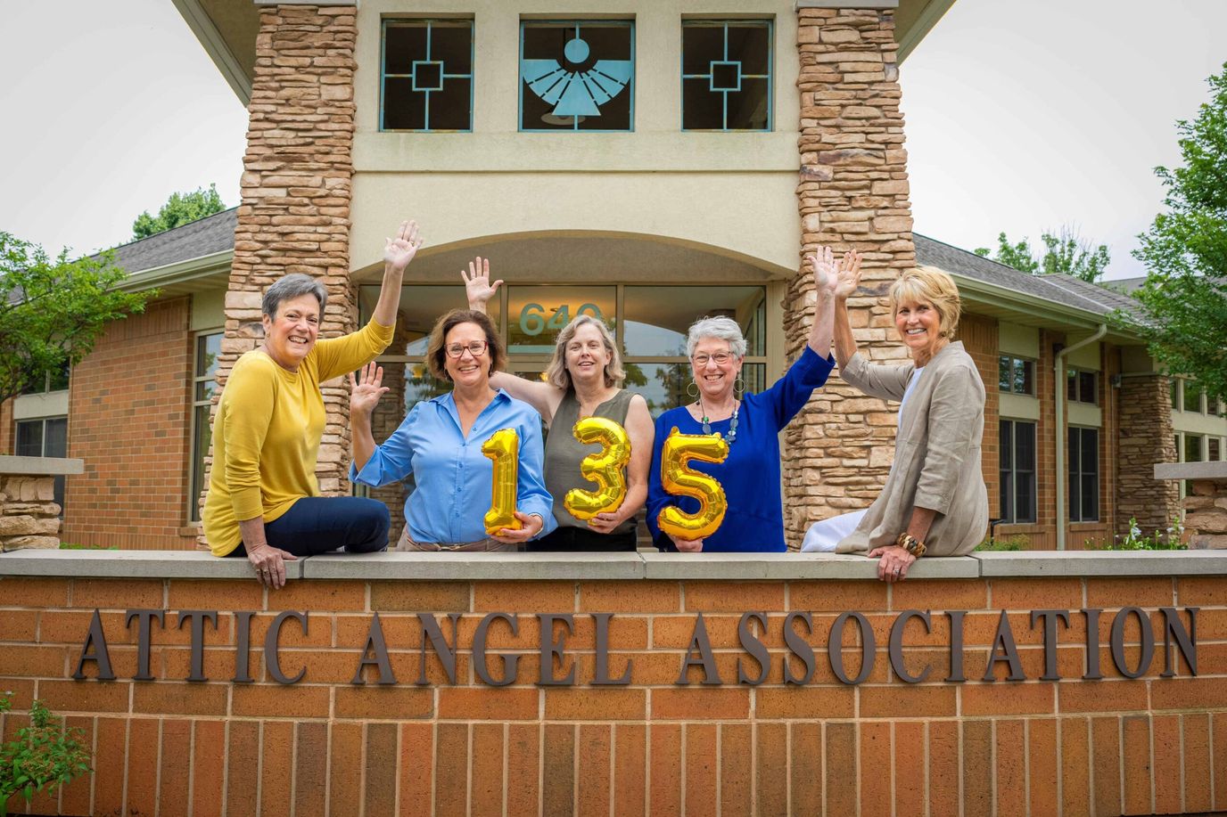 Attic Angel Place, assisted living — Celebratory group of women holding balloons outdoors