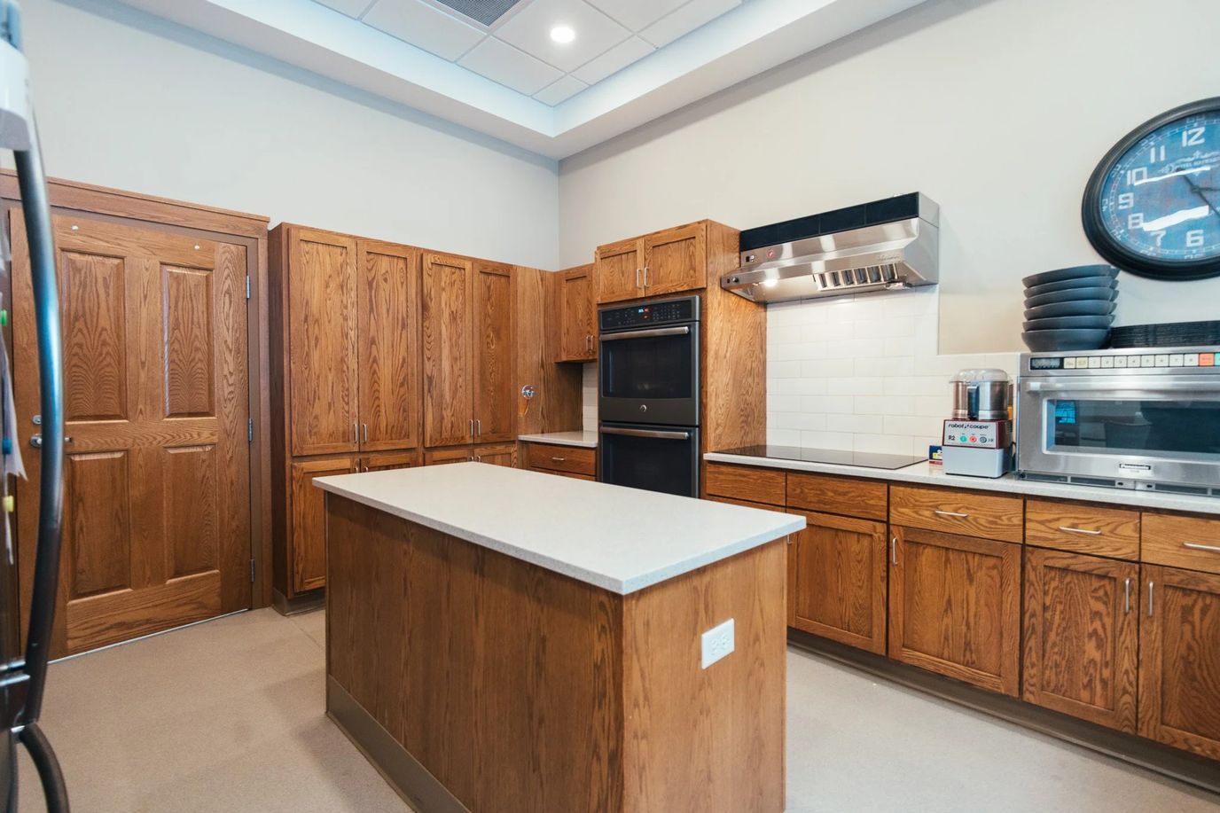 Creekside Assisted Living, assisted living in Sparta, WI — Modern kitchen with wooden cabinets and stainless steel appliances