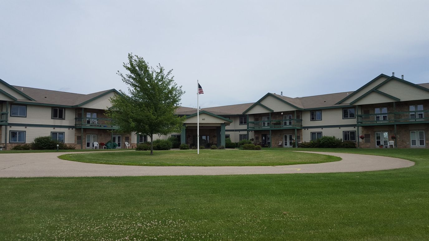 Exterior view of Stonefield Apartment Homes with landscaped grounds