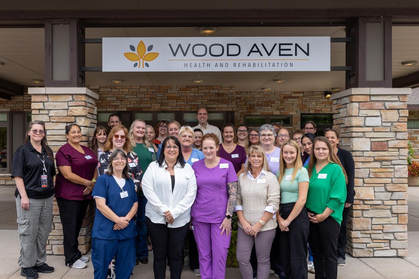 Staff gathering outside the Wood Aven facility