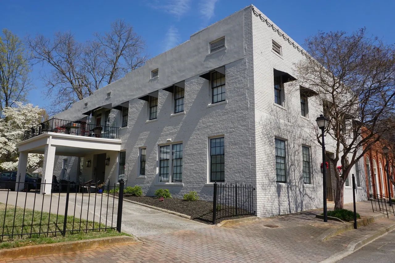 Exterior view of Madison House facility with outdoor space