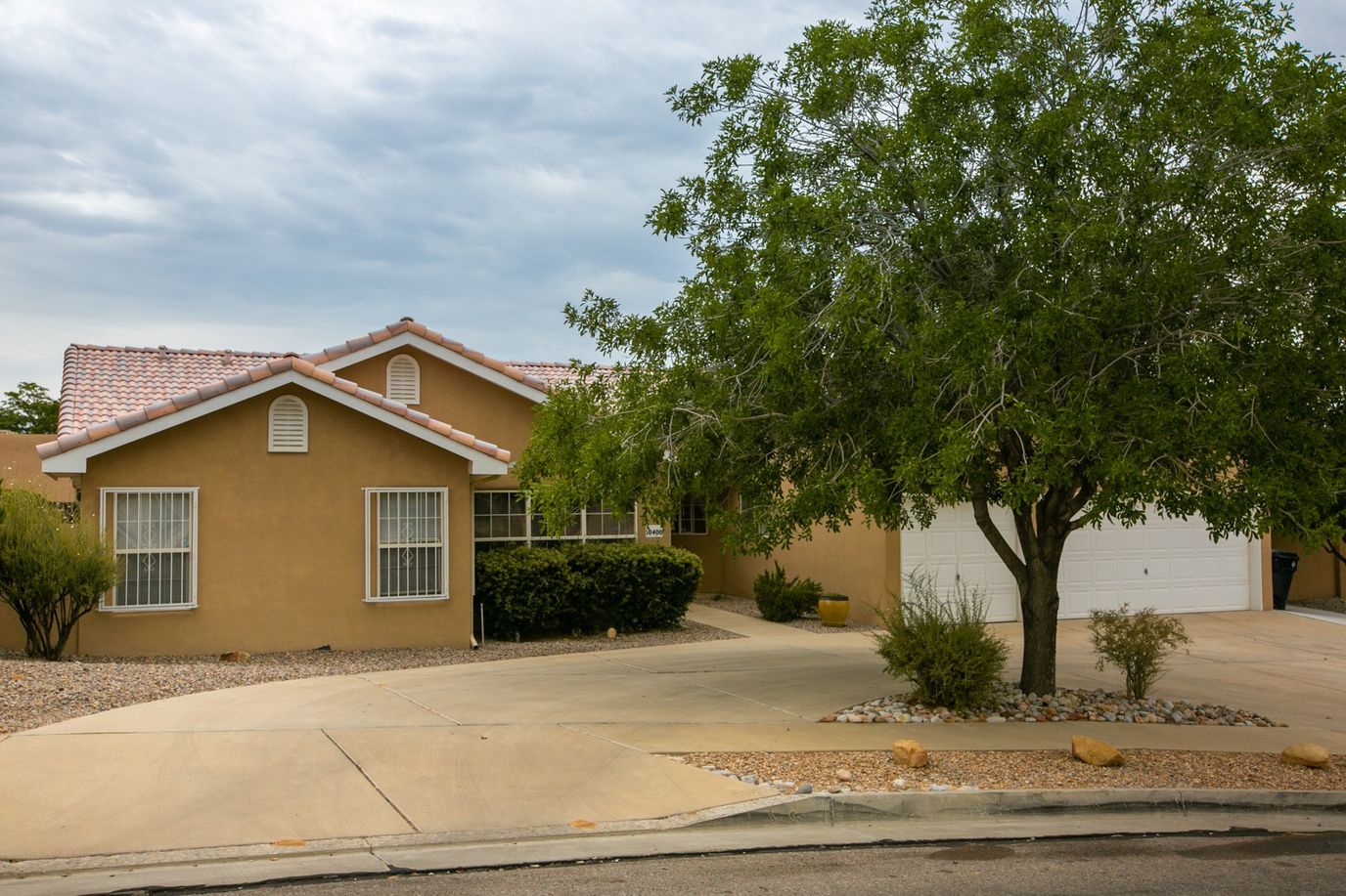 Exterior view of a senior living facility surrounded by landscaping