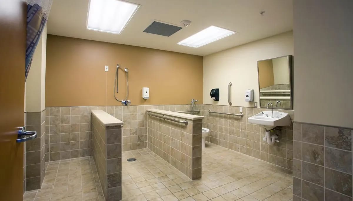 Accessible restroom with grab bars and sink