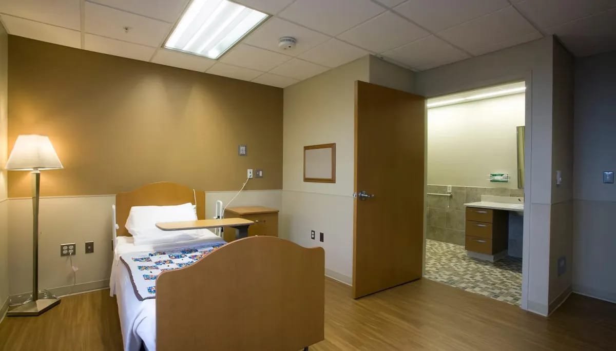 Private resident room with a bed and bathroom