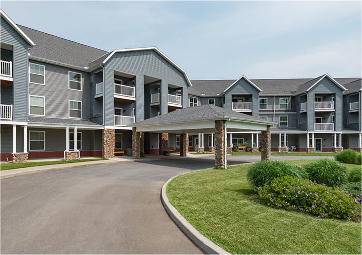 Exterior view of the facility with landscaped gardens