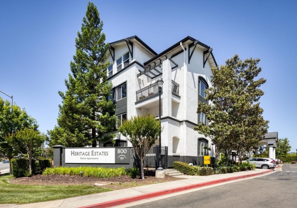 Exterior view of Heritage Estates building with signage