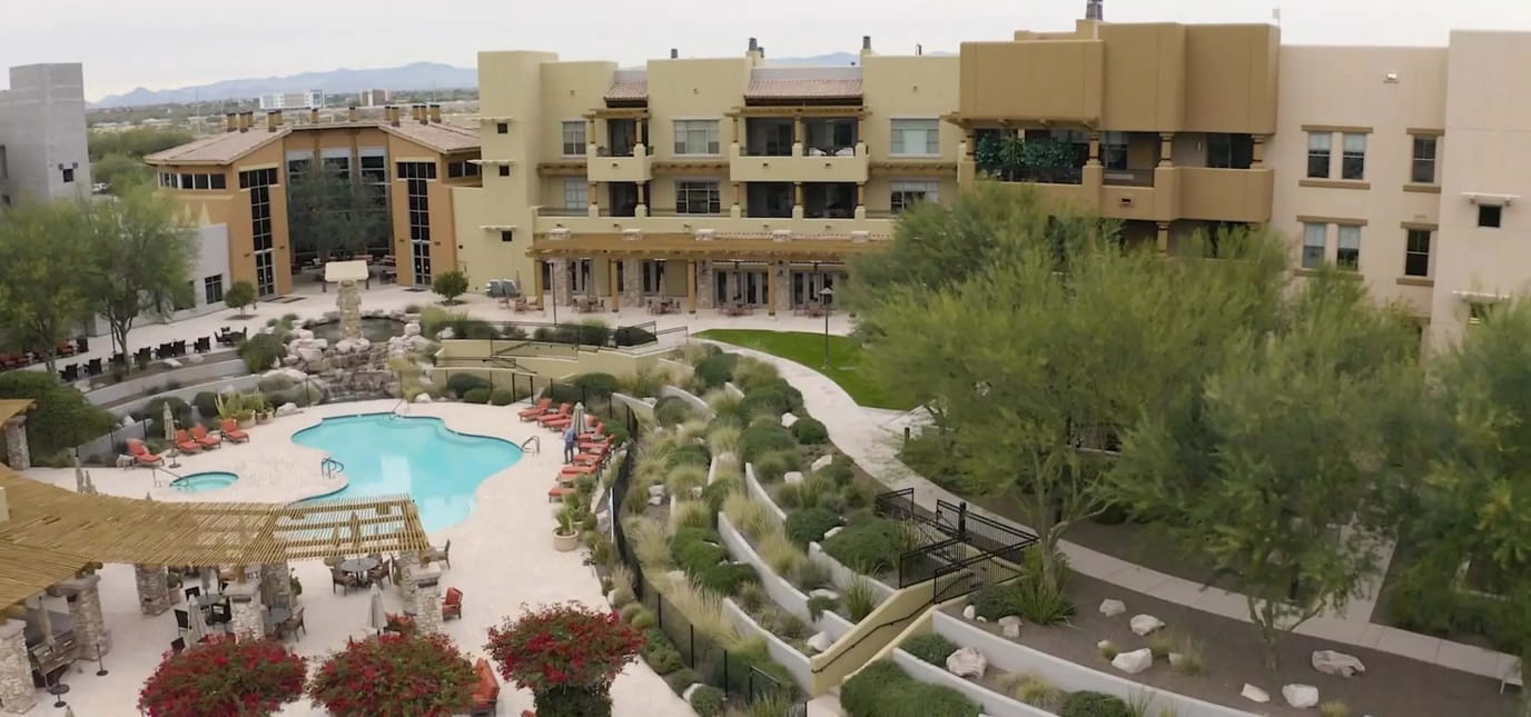 Aerial view of the Acacia Health Center with a pool