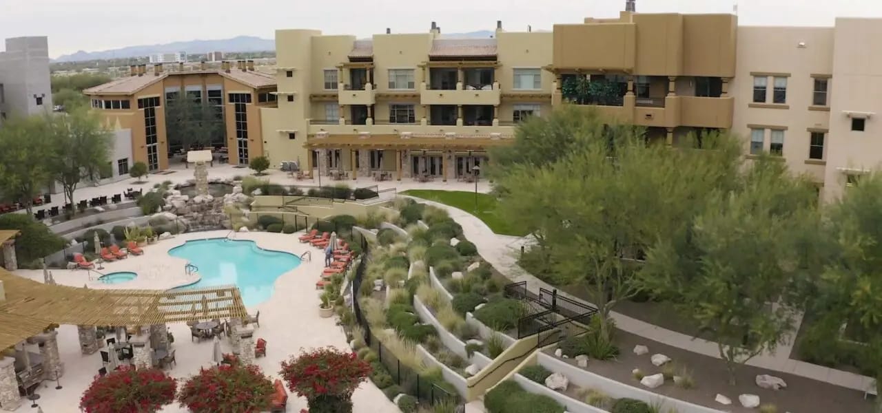 Aerial view of the Acacia Health Center with pool and gardens