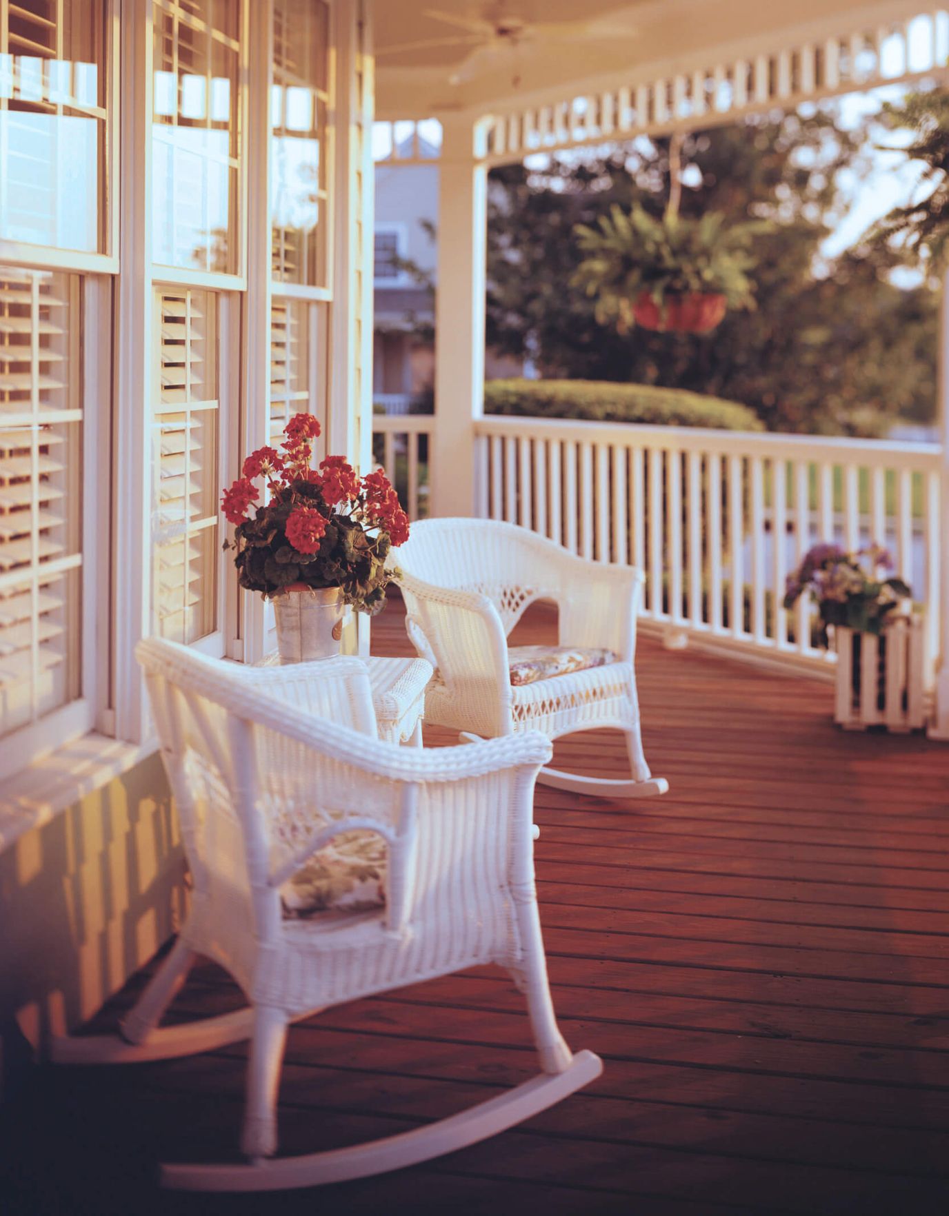 Outdoor porch with rocking chairs and flowers
