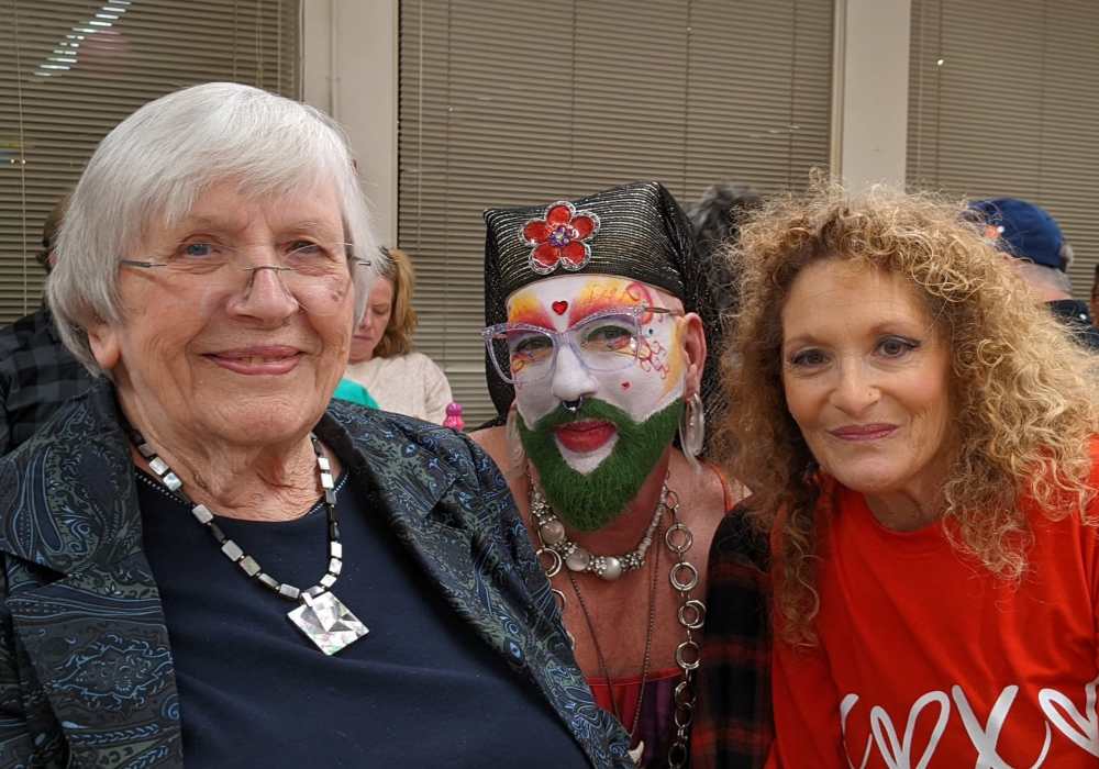 Three residents enjoying a festive event together.