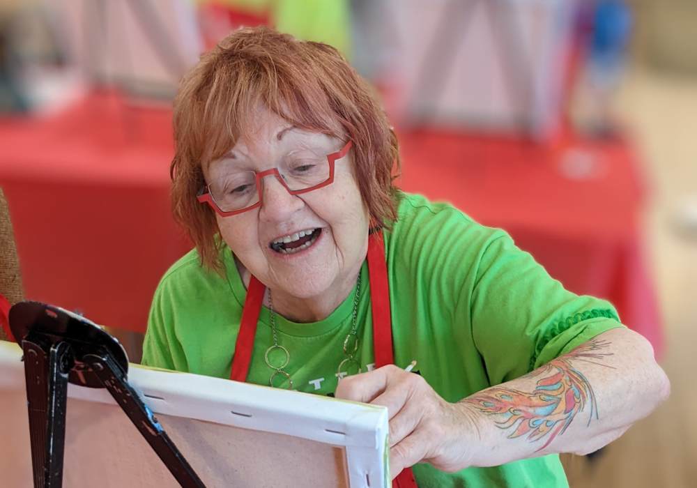 Senior woman engaged in painting activity