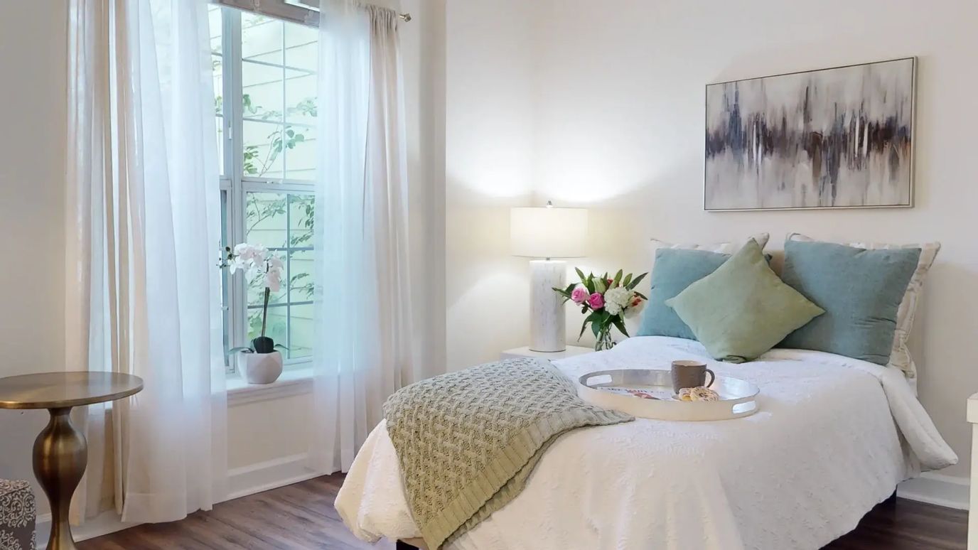 Cozy private resident room with flowers and decor.