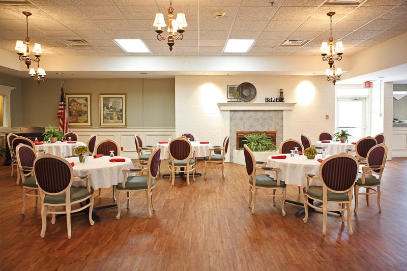 Dining room setup with tables and chairs
