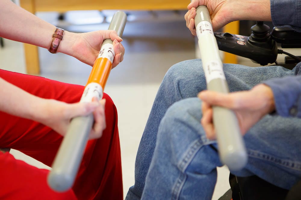 Two individuals engaging in a therapeutic activity