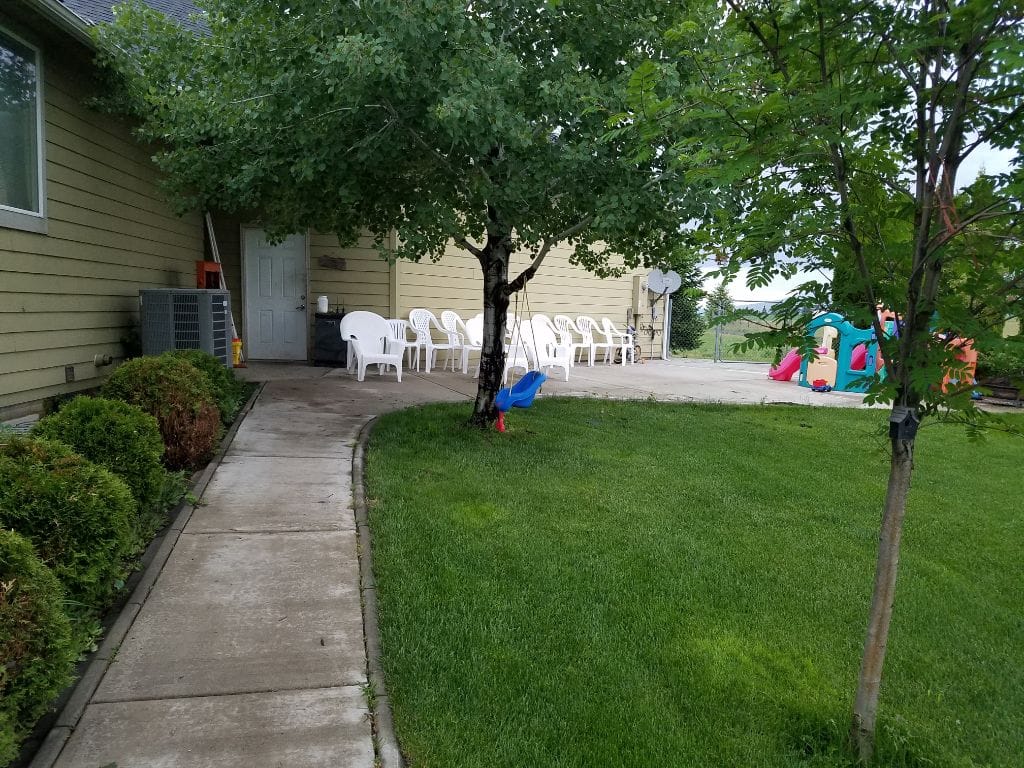 Outdoor seating area with path and trees