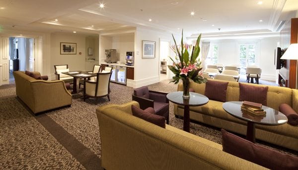 Common area with seating and floral arrangements