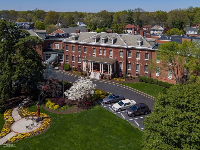 Aerial view of Hermitage Richmond showcasing the building and landscaped grounds.