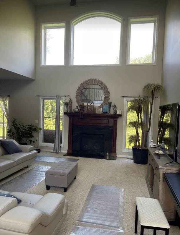 Cozy common area with large windows and fireplace