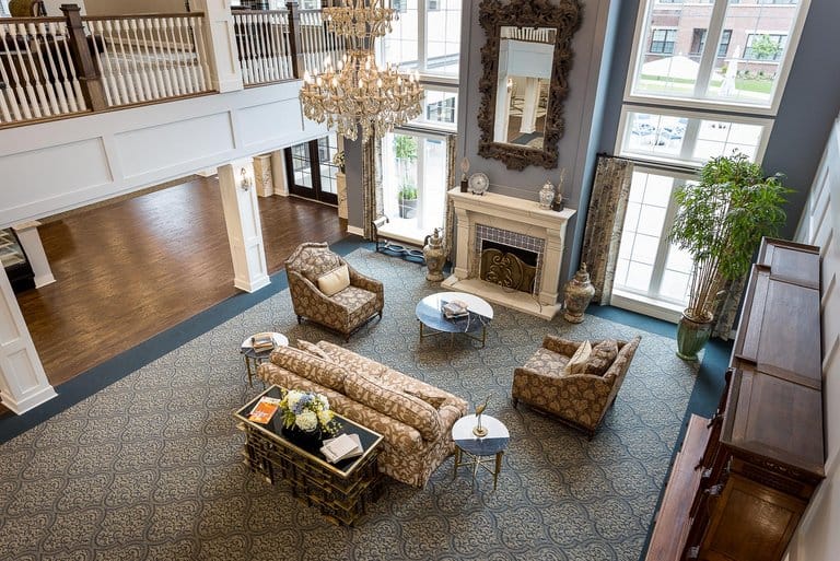 Bright common area with elegant furniture and chandelier