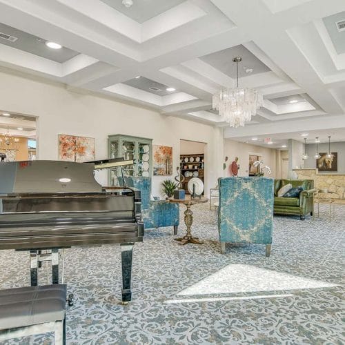 Bright and welcoming common area with a piano