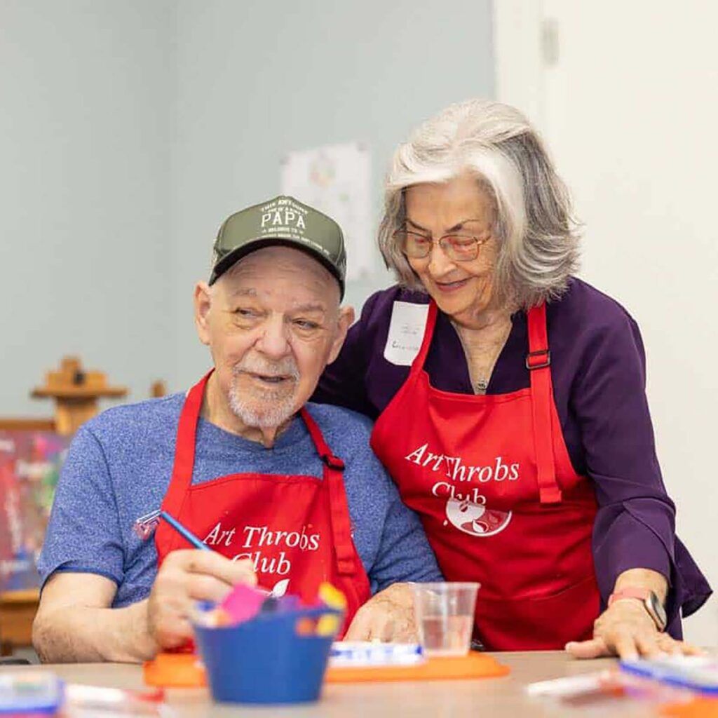 Residents engaged in an art activity at the facility