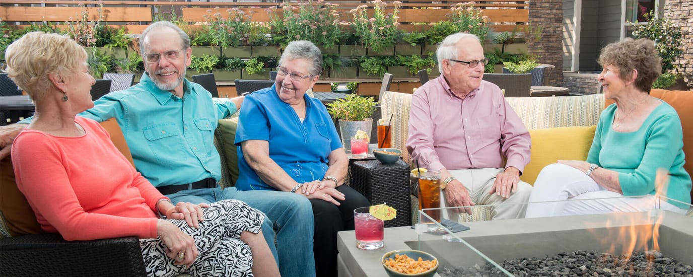 Residents enjoying a social gathering in an outdoor space.