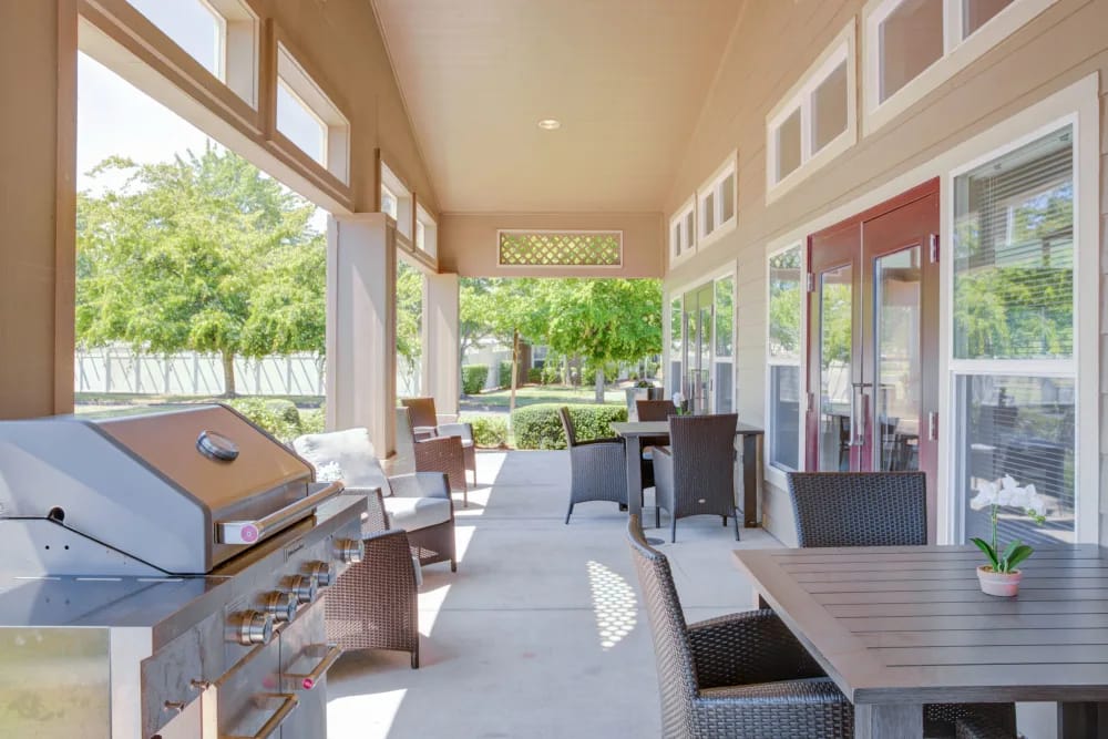 Patio area with outdoor seating and grill station