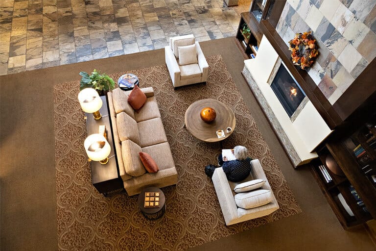 Cozy lobby area with a resident reading