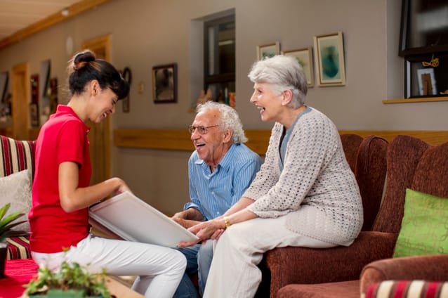 Residents and staff engaged in a conversation.