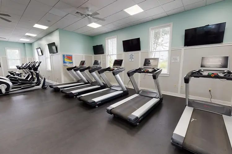 Interior of a fitness center with treadmills and exercise equipment