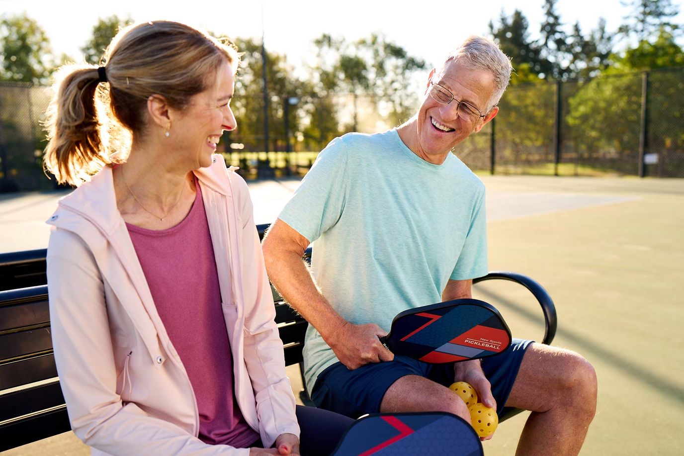 Residents enjoying a game of pickleball outdoors