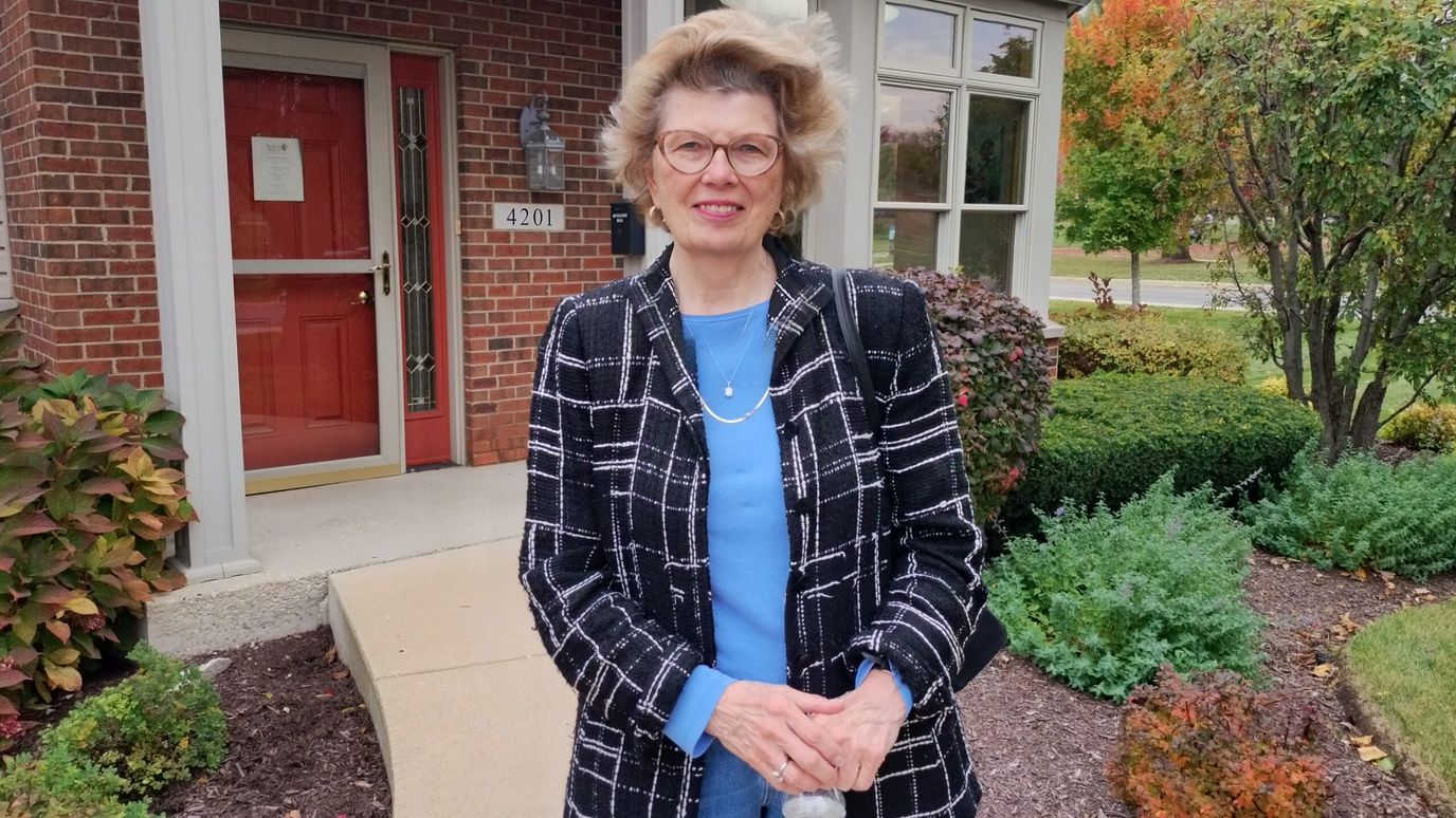 Resident standing outside the entrance of Peterson Meadows