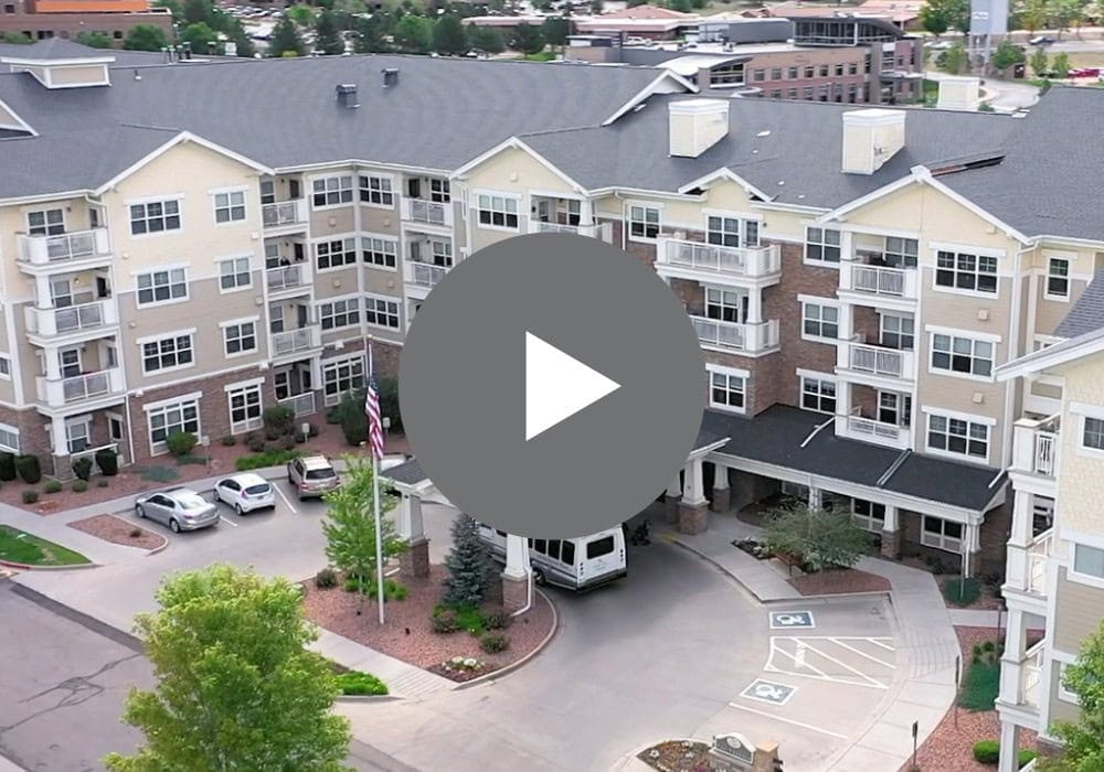 Aerial view of the building's entrance and parking area