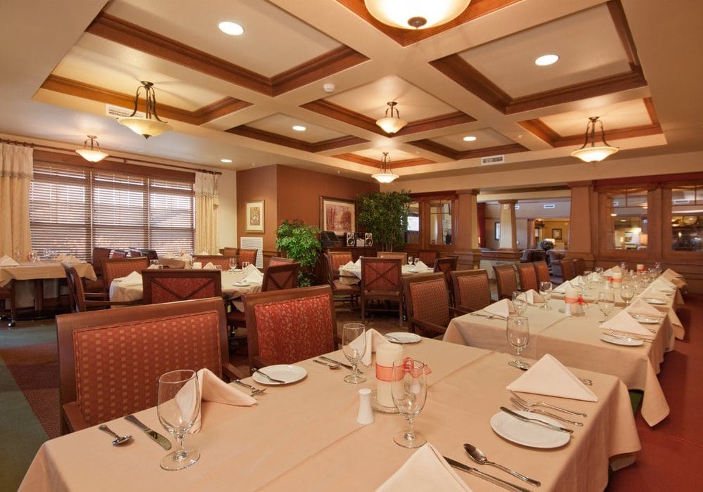 Dining area with neatly set tables and decor