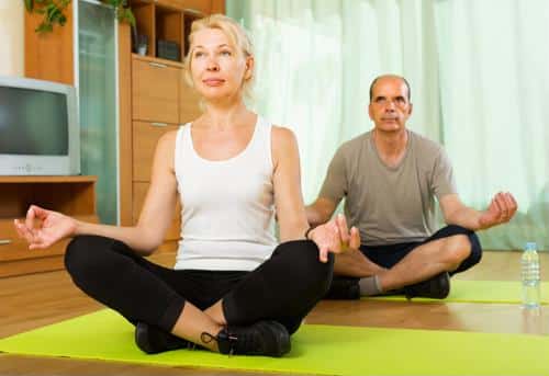 Residents participating in a yoga session indoors
