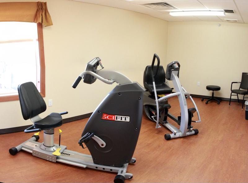 Fitness equipment in a well-lit exercise room