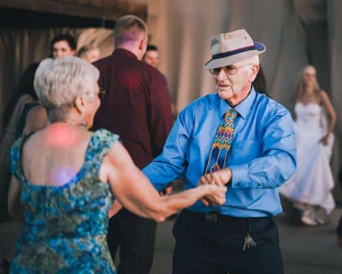 Residents dancing joyfully at a celebration