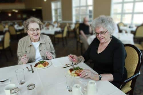 Residents enjoying meals in the dining room