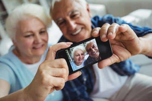 Couple taking a selfie together, smiling