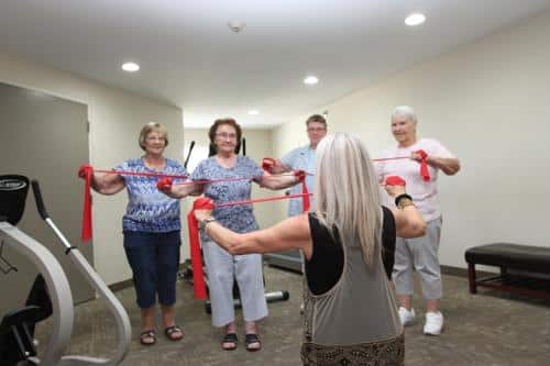 Residents participating in a group exercise activity