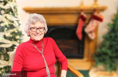 Resident smiling in a cozy indoor setting