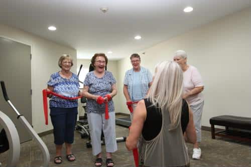 Residents engaged in a group exercise activity indoors