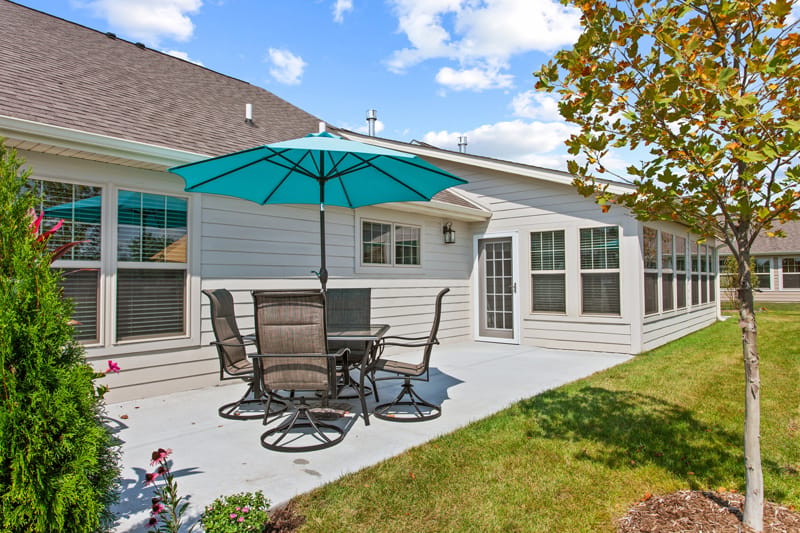 Outdoor patio area with seating and an umbrella