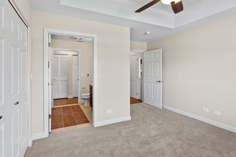 Interior view of a resident room with carpet and doorways